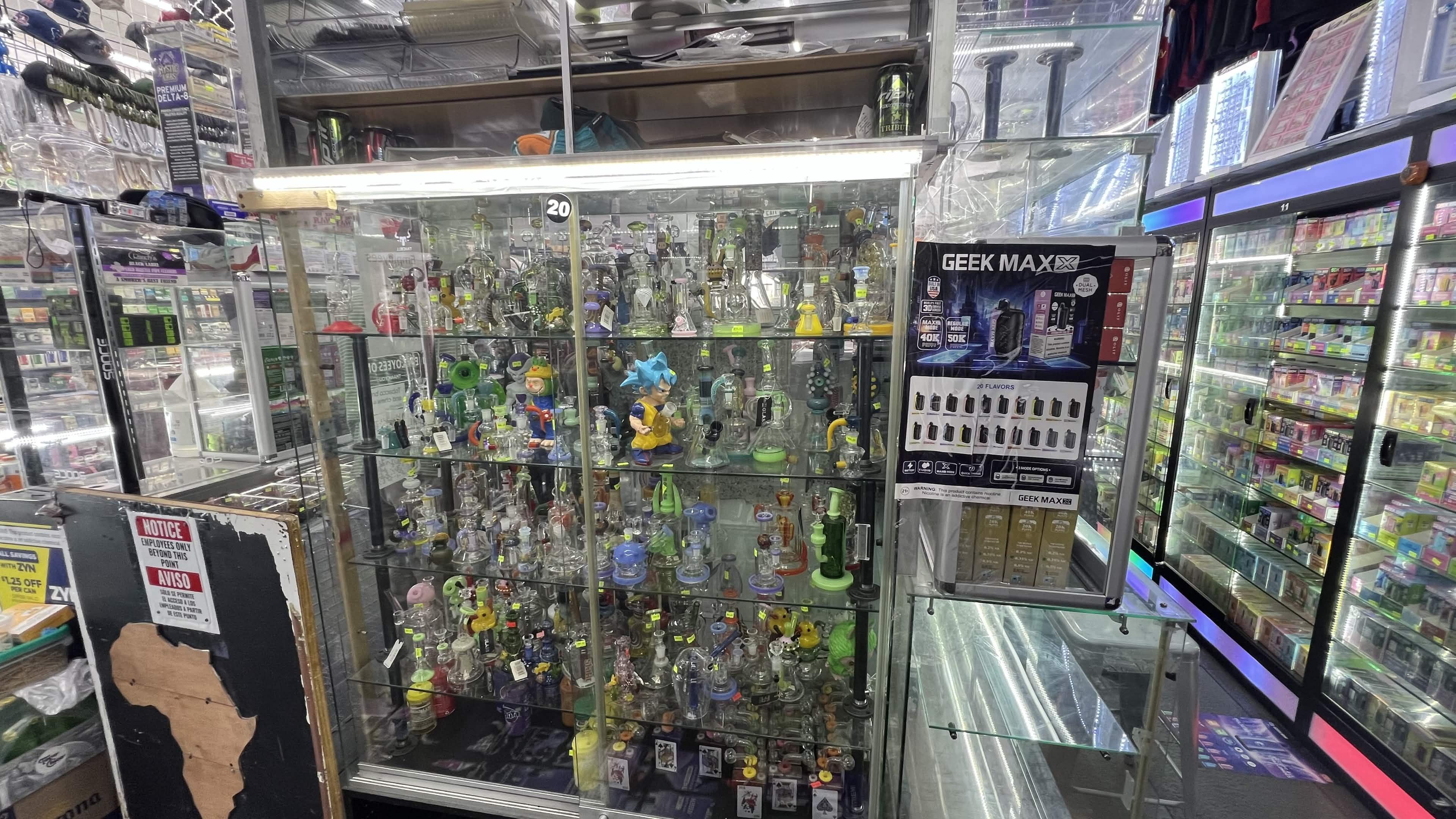 Glass display case full of water pipes and hand-blown glass pieces inside Tobacco Brew & Chew